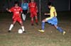 Rafael Godinho of Tuxpan keeping the ball away from Rodolfo Marin of Casual(yellow)