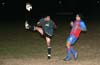 Cesar Bautista of Bayberry(left) clearing the ball in front of Roger Quinceno of Bateman