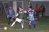 Jeff Esposito of Bayberry stopping the ball while Alex Cannon(goalie) and Bernabe Hernandez of Tuxpan look on