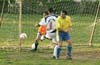 Luis Vas of Tuxpan(white) fighting with Mike Hartman of Casual(right) and Alejandro Bolonas of Casual(goalie)