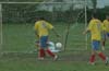 Alfredo Megrete of GEO(ground) preventing the ball from entering the goal from a shot taken by Cesar Galea(#9)