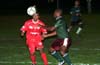 Raul Moreno of Tuxpan(left) and Dwight Amade of Bayberry going for the ball