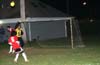 Alejandro Bolanos of Tuxpan(yellow) coming out to punch the ball away from Steven Orrego of Tortorella