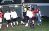 Action in front of the Bateman goal, with Duvan Castro(yellow) jumping to clear the ball