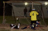 Alfredo Negrete of Race Lane(left on ground) is able to save the goal by Jonathan Lizano of Tuxpan