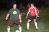 Jon Archer of Bayberry(left) protecting the ball from Gary Easlick of Tortorella