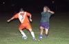 Alberto Larios of Tuxpan(left) just too fast for Jerome Albertini of Bayberry