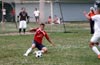 Christian Munoz of Tortorella sliding to clear the ball out of danger