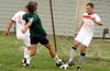 Manuel Lizano of Bateman(right) about to clear the ball from Jerome Albertini of Bayberry(gree)