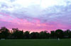 A summer sunset behind Alfredo Negrete of Hamptons Arsenal