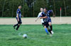 Jon Wagner of Espo's(front) about to clear the ball but the field