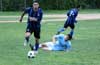 Gehider Garcia of Maidstone Market going over the sliding tackle by Jon Lizano of Bateman Painting