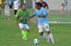 Mark Hogg of Bateman Painting(right) being defended by Estuardo Larios of FC Tuxpan