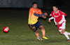 John Romero of Maidstone(left) can not turn around fast enough to steal the ball from Esteban Uchupaille of Tortorella