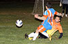 Gerber Garcia of Maidstone(rear) sliding to steal the ball from Cesar Correa of The Hideaway