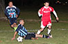 Julian Munoz of Bateman(ground) sliding to steal the ball from Daniel Bedoya of Tortorella