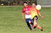 Carlos Torres of Maidstone Market(right) kicking the ball away from Emilio Espinoza of FC Tuxpan