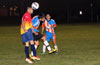 Juan Velazquez of FC Tuxpan heading the ball before Christian Bautista of The Hideaway can