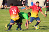 A Hampton FC forward(center) trying to get by Juan Velazquez(left) and Emilio Espinoza of FC Tuxpan