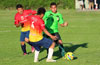 A Hampton FC forward(center) trying to get by Alberto Carreto(left) and Emilio Espinoza(rear) of FC Tuxpan