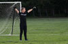 Craig Caiazca, the Tortorella Pools keeper, doing calisthenics when the ball is at the other end of the field