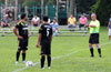 Martin Suniga(left) and Oscar Reinoso of Hampton FC looking at Alex Ramirez, as he makes sure the game starts at 7 40pm
