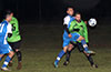 Cristian Munoz of Tortorella(blue) hitting the ball away from Jose Almansa of Hampton FC