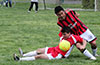 Eddie Lopez(ground) of Tortorella Pools protecting the ball from Cesar Bautista of Cuenca FC