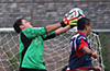 Tortorella keeper, Alex Mesa, jumps to grab the ball from Diego Marles of Maidstone Market