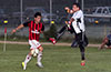 Marco Bautista of Cuenca FC(left) about to beat Olger Araya, Hampton FC keeper, to score