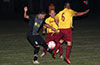 All going for the ball, Maidstone(left) and FC Tuxpan(right)