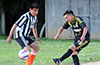 Oscar Reinoso of Hampton FC(right) kicking the ball past Diego Urbano of Sag Harbor United
