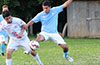Mario Olaya of Maidstone(right) jumping in front of Andres Perez of FC Tuxpan