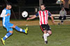 Rafael Godinho of Tortorella Pools trapping the ball in front of Andre Gardini of Bateman Painting