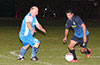 Gehider Garcia of Hampton FC(right) about to get by Leslie Czeladko of Tortorella Pools