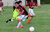 Cesar Metamarot of Sag Harbor(front) trying to turn before Oscar Reinoso of Hampton FC(rear) can get the ball