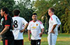Bateman Painting team manager, Enrique Pichardo, talking strategy with his team mates