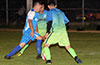 Alejandro Bolanos of Tortorella Pools trying to dribble between two FC Tuxpan defenders