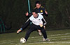 FC Tuxpan goalie, Jorge Lopez, grabbing the ball in front of Andry Cruz of Hampton FC