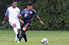 Cristian Flores of Hampton FC(right) could not block the pass by Emigdio Rugama of Sag Harbor