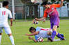 Erasmo Guzman of Sag Harbor falling on the ball as Edgar Alvarez of FC Tuxpan watches