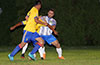 Gerber Garcia of Hampton FC(right) pushing the FC Tuxpan defender for the ball