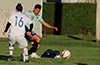 Jose Gutierrez of FC Tuxpan(rear) blasting the ball up the field
