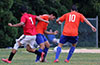Gustavo Gutama of EH Soccer Fever(center) watching the ball