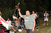 Domingo Perez, Sag Harbor United manager, holding up the first place trophy