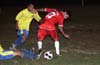 Rafael Godinho of Tuxpan protecting the ball from Christian Munoz and a Casual defender