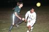 Ian Hanbach of Bayberry(left) and a Tuxpan defender fight to determine who will head the ball