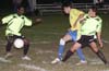 Romulo Tubatan of L.I. Rottweilers(right) holding off Rodolfo Marin(center) of Casual so that team mate Airick Samules(left) can get by