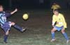 Barnabe Hernandez of Tuxpan, trapping the ball in front of Christian Munoz of Casual