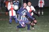 Elias Sandoval(front) of Tuxpan and Carlos Torres(rear) of Bateman fighting for the ball in front of the Bateman goal